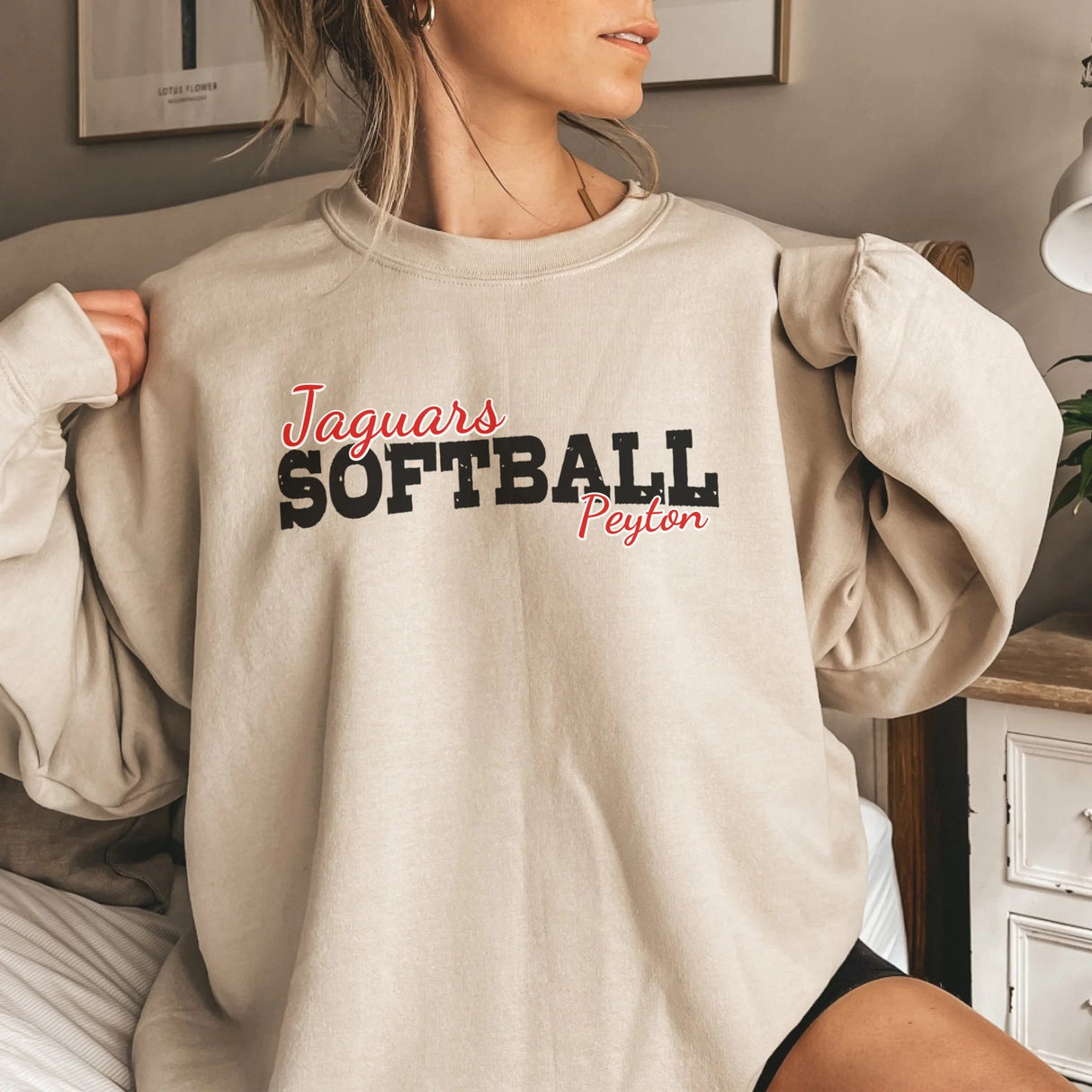 Custom Softball Mascot and Softball Player Name on a Sweatshirt with a Black Graphic