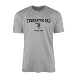 gymnastics dad with gymnast icon and gymnast name on a mens t-shirt with a black graphic