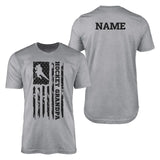 hockey grandpa vertical flag with hockey player name on a mens t-shirt with a black graphic