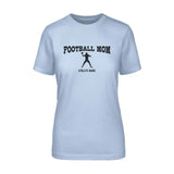 football mom with football player icon and football player name on a unisex t-shirt with a black graphic