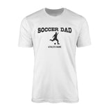 soccer dad with soccer player icon and soccer player name on a mens t-shirt with a black graphic