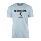 soccer dad with soccer player icon and soccer player name on a mens t-shirt with a black graphic