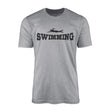 basic swimming with swimmer icon on a mens t-shirt with a black graphic