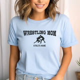 wrestling mom with wrestler icon and wrestler name on a unisex t-shirt with a black graphic