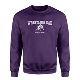 wrestling dad with wrestler icon and wrestler name on a sweatshirt with a white graphic