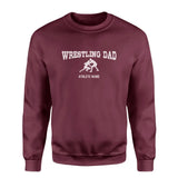 wrestling dad with wrestler icon and wrestler name on a sweatshirt with a white graphic