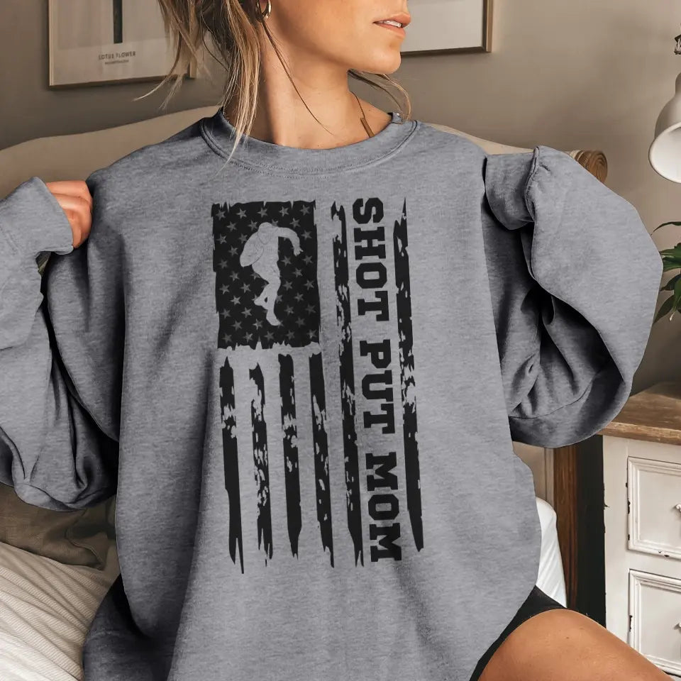 shot put mom vertical flag on a sweatshirt with a black graphic