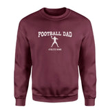 football dad with football player icon and football player name on a sweatshirt with a white graphic