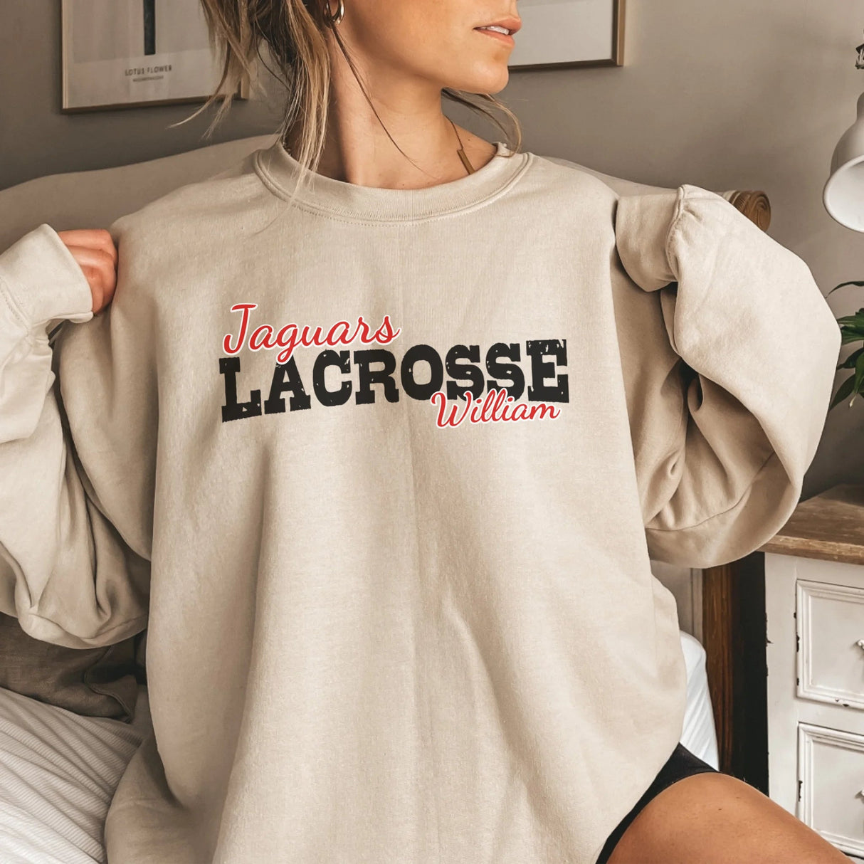 Custom Lacrosse Mascot and Lacrosse Player Name on a Sweatshirt with a Black Graphic