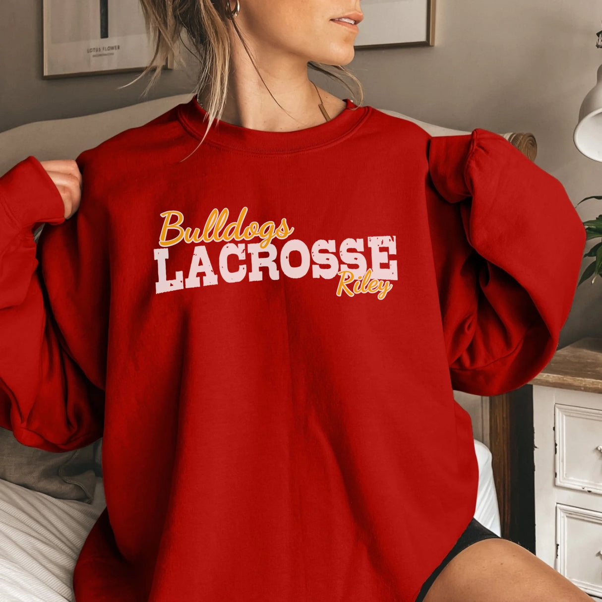 Custom Lacrosse Mascot and Lacrosse Player Name on a Sweatshirt with a White Graphic