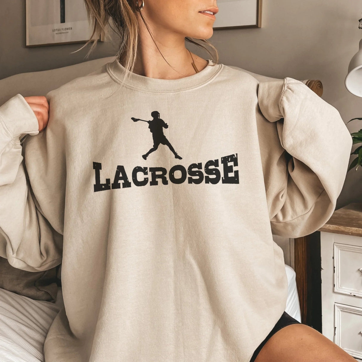 Basic Lacrosse with Lacrosse Player Icon on a Sweatshirt with a Black Graphic